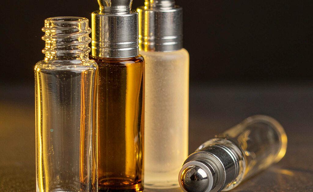 Roll-on perfume bottles in clear, amber and frosted glass with stainless steel ball applicators and aluminum caps