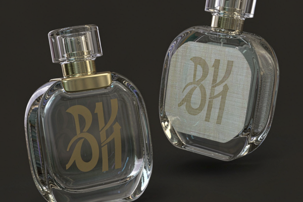 Perfume bottle label vs print comparison showing screen printed gold logo and paper label on glass bottles